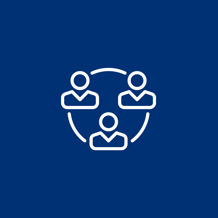 White icons of four people in a circle on a blue patterned background, representing collaboration.