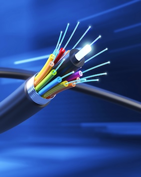 A close-up image of a fiber optic cable with exposed, color-coded wires