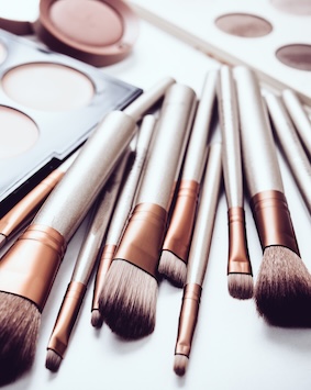 Makeup brushes and palette, essentials for beauty and cosmetics.