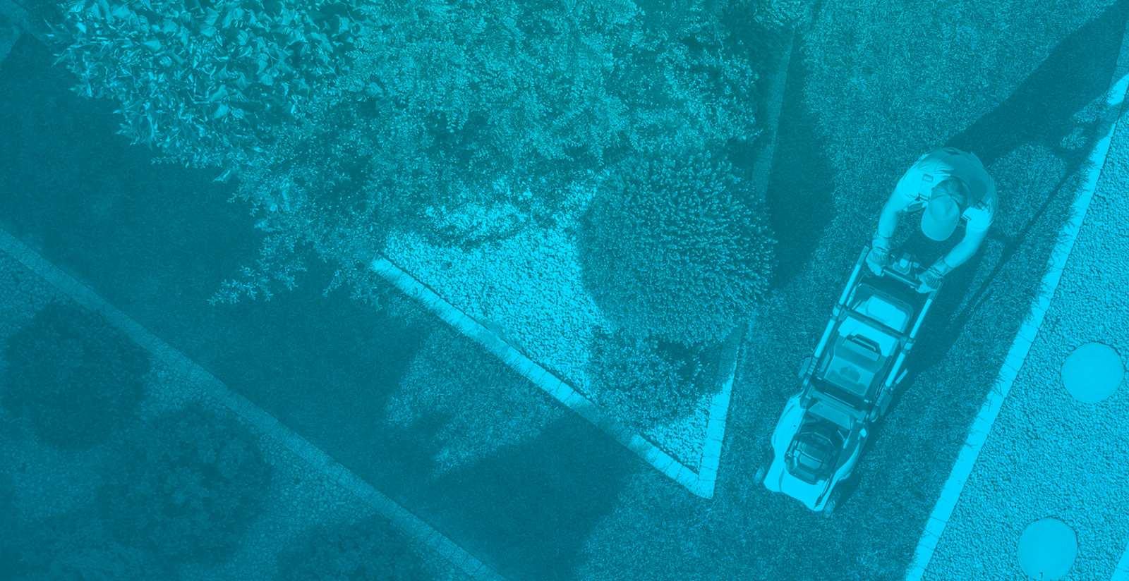 Image showing an aerial view of a compound with someone mowing the lawn.